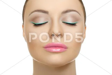 Closeup face of beauty woman with blue eyeliner make-up Stock Photos