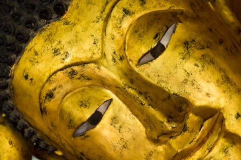 Closeup of the face of a Buddha statue Stock Photos