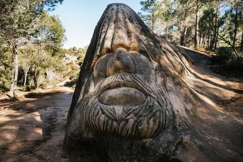 Closeup of a face carved in stone at Ruta de las Caras in Buendia, Cuenca, Spain Stock Photos