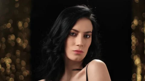 Closeup face lady flirting posing at light sparkle disco bokeh. Shot on RED Stock Footage 150688150