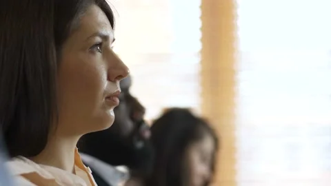 Closeup face profiles of diverse seminar listeners Stock Footage 108010488