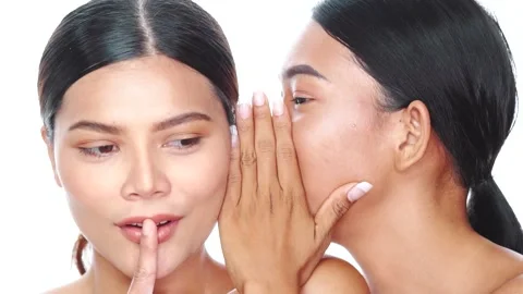 Closeup faces ot two beautiful Asian women over white background Vídeo Stock 136664733