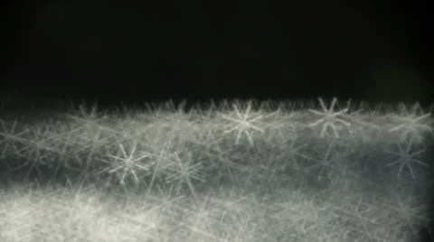 Closeup of fast moving shining sparkles on dark background. Видео 45695845