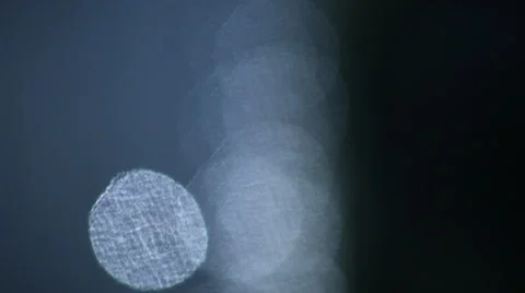 Closeup of fast vertical moving sparkles on dark background. Vídeos de archivo 45680509