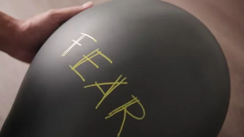 Closeup of Fear Balloon Held from Below Stock Footage 311688596