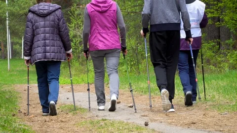 A closeup of the feet of group of people practicing Nordic walking. Stock Footage 119070686