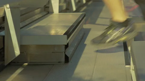 Closeup of Feet Running up and Down Bleachers Stock Footage 57868784