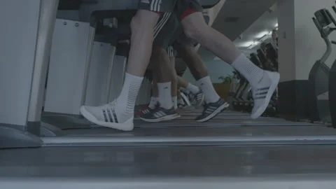 Closeup of Feet Running on a Treadmill Stock Footage 154002928