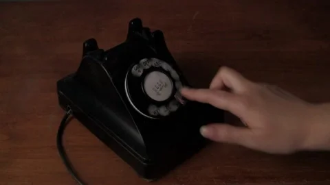 Closeup of Female Hand Using 1930s Black Rotary Phone from Start to Finish Stock Footage 162930413