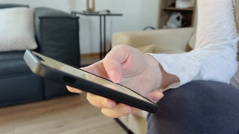 Closeup of female hand using mobile smart phone Video stock 173529661