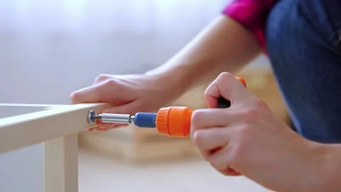Closeup of female hand using screwdriver Stock-Footage 244640898