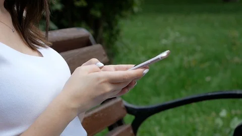 Closeup of female hand using a smart phone. Shallow depth of field Video stock 100598774