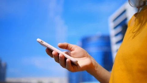 Closeup Of Female Hand Using Smartphone In City. Stock Footage 123121777