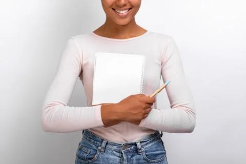 Closeup female hands hugging empty paper notebook and pen, Concept education  Stock Photos