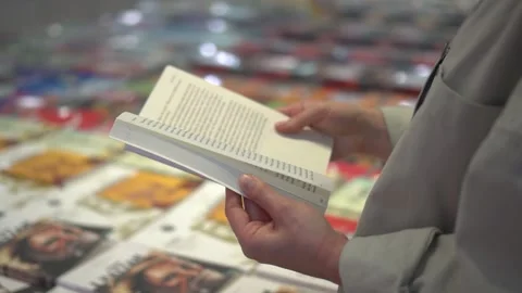 Closeup Female Hands Leafing Through A Book. Video stock 170609571