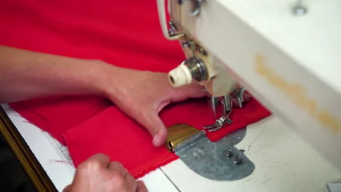 Closeup of female hands with manicure working on a sewing machine. Stock-Footage 139782885