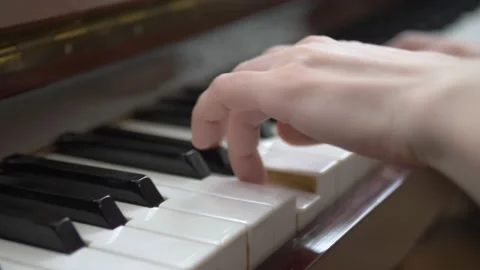 Closeup. female hands masterfully play the arpeggio on the piano Stock Footage 131237836