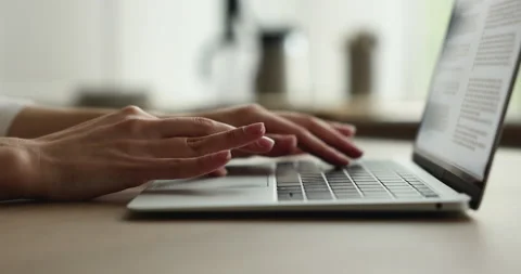 Closeup female hands typing message on laptop seated at desk Vídeos de archivo 220170482