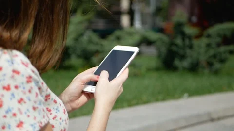 Closeup of female hands using app via modern smartphone device outdoors, hipster 스톡 동영상 99409326