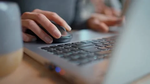 Closeup female hands using laptop, computer mouse and keyboard Video stock 130252191