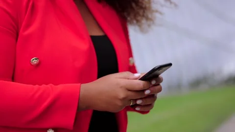 Closeup of female hands using phone Stock Footage 254650613
