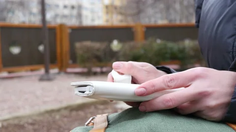 Closeup female reading e-book outdoors in park Stock Footage 60110477