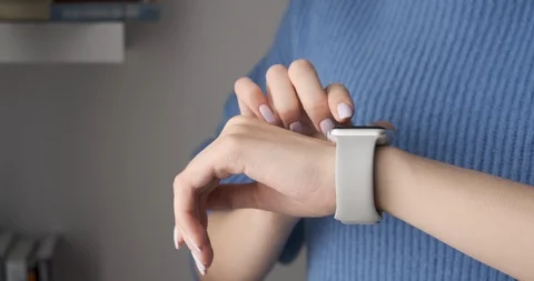 Closeup of female using smart watch app indoors. Stock Footage 104405468
