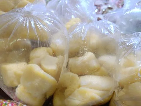 Closeup of fermented cassava in the plastic Stock Photos