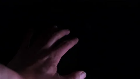 Closeup of finder of man's hand knocking in dark background. Stock Footage 238603180