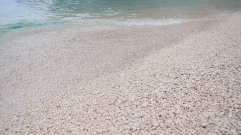 Closeup of fine stone pebbles on the beach Stock Footage 112118787