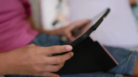 Closeup finger gesturing playing game on digital tablet Stock Footage 167785430