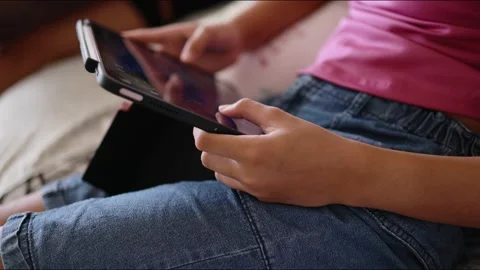 Closeup finger gesturing playing game on digital tablet Stock Footage 167785565