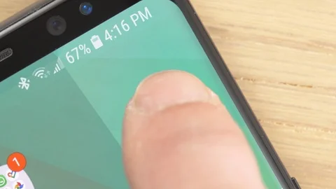 Closeup on a Finger Opening Android Auto app Icon on a Smartphone 動画素材 107229469