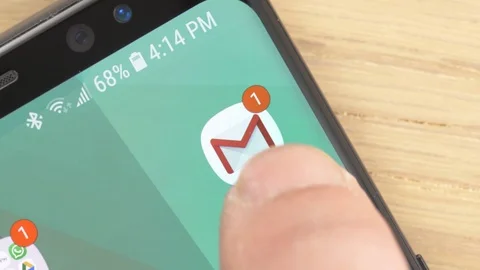 Closeup on a Finger Opening Gmail app Icon on a Smartphone Stock Footage 107230036