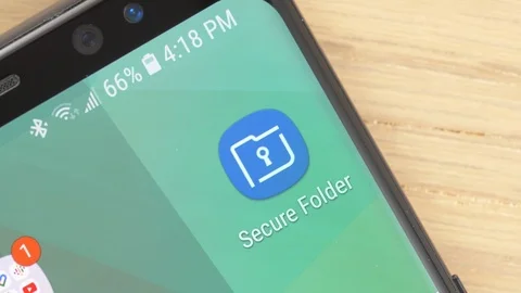 Closeup on a Finger Opening a Secure Folder app Icon on a Smartphone Stock Footage 107229260