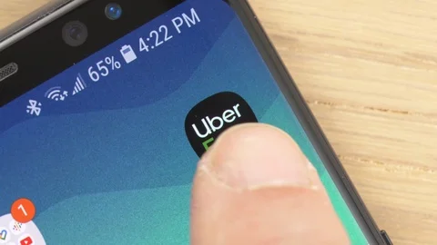 Closeup on a Finger Opening Uber Eats app Icon on a Smartphone Stock Footage 107231145