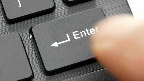 Closeup finger pressing enter key on computer keyboard Stock Footage 127461082