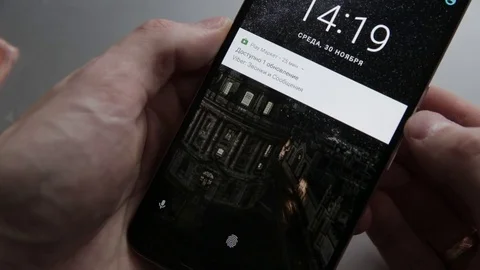 Closeup of finger touching a android smartphone to unlock Stock Footage 70141037
