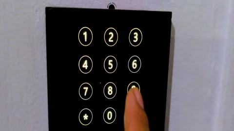 Closeup of finger touching a secure keypad to enter password code and unloc.. Stock Footage 341827097