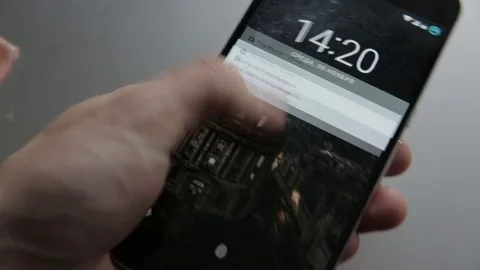 Closeup of finger touching a smartphone with a touch screen to unlocking phone Stock Footage 70140818