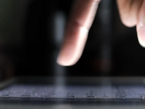 Closeup finger touching tablet computer touchscreen Video stock 80359522