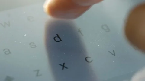 Closeup finger typing on touch screen keyboard Stock Footage 127460499