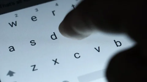 Closeup finger typing on touch screen keyboard Stock Footage 127460893