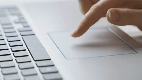 Closeup fingers touching laptop computer touchpad. Search information online and Video stock 101868045