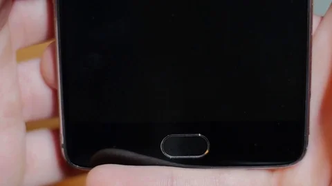 Closeup of fingers typing on a touchscreen keyboard Stockbeeldmateriaal 84305192