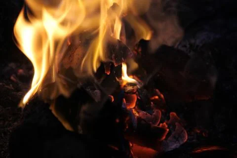 Closeup Fire Burning firewood. Abstract Flame. The dying embers with white sm Stock Photos