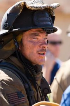 Closeup of fire fighter at work Stock Photos