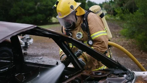 Closeup of firefighter training on car fire - Stock Footage 87842738