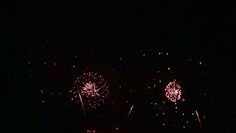 Closeup of fireworks exploding in the night sky. Explosion of pyrotechnics. 4K Stock Footage 280535413