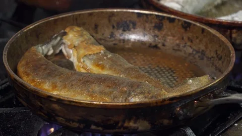 Closeup of fish fried on a pan Stock Footage 74081495